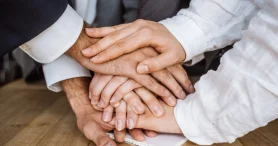 united-hands-business-team-workspace-background